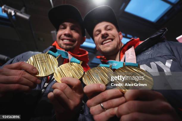 Luge doubles olympic champions Tobias Wendl and Tobias Arlt pose with their gold medals during the welcome ceremony for the members of Team Germany...