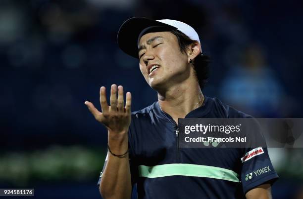 Yoshihito Nishioka of Japan reacts against Benoit Paire of France during day one of the ATP Dubai Duty Free Tennis Championships at the Dubai Duty...