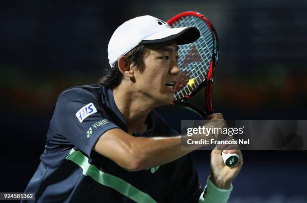 Yoshihito Nishioka of Japan in action against Benoit Paire of France during day one of the ATP Dubai Duty Free Tennis Championships at the Dubai Duty...