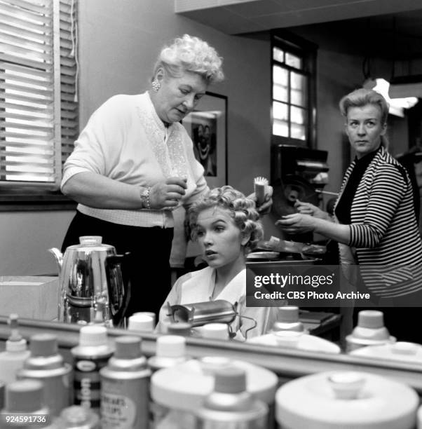 Television program, Alfred Hitchcock Presents. Episode: Craig's Will. Standing at left, hair stylist Florence Bush, works on actress Stella Stevens...