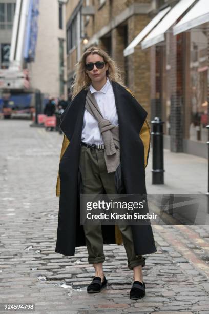 Editor in chief of MINT Magazine Irina Lakicevic wears a Toteme jumper, Pringle of Scotland jacket, Burberry trousers and The Stores shoes on day 5...