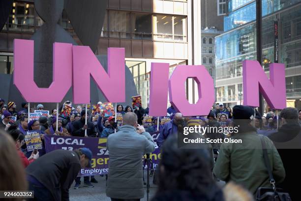 Members of the Service Employees International Union hold a rally in support of the American Federation of State County and Municipal Employees union...