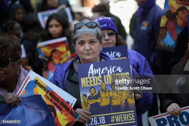 Members of the Service Employees International Union hold a rally in support of the American Federation of State County and Municipal Employees union...