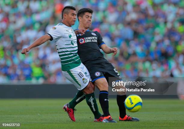 Osvaldo Martinez of Santos fights for the ball with Francisco Silva of Cruz Azul during the 9th round match between Santos Laguna and Cruz Azul as...