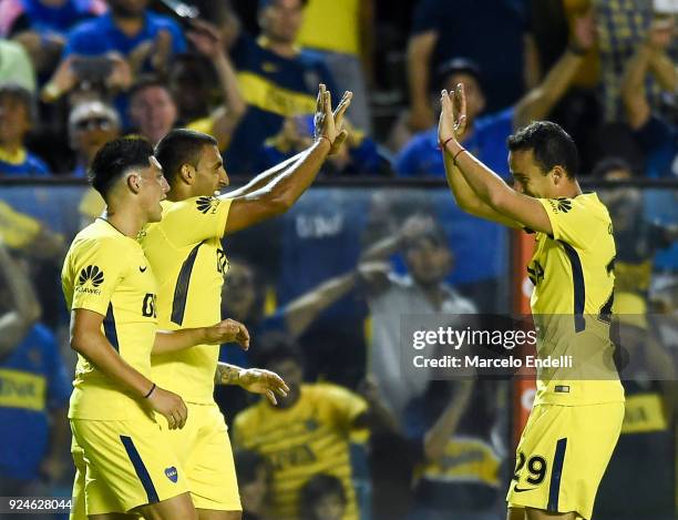 Ramon Abila of Boca Juniors celebrates with teammate after scoring the fourth goal of his team during a match between Boca Juniors and San Martin de...