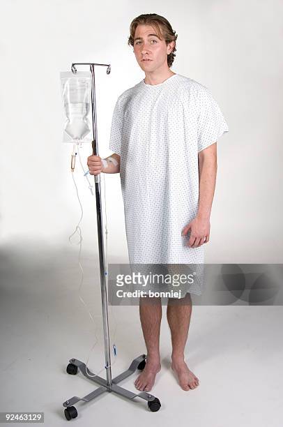 patient with iv - examination gown stock pictures, royalty-free photos & images