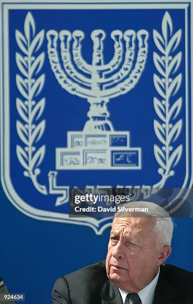 Israeli Prime Minister Ariel Sharon listens to speeches during the installation ceremony of Lieutenant-General Moshe Ya'alon as Israel's 17th Chief...