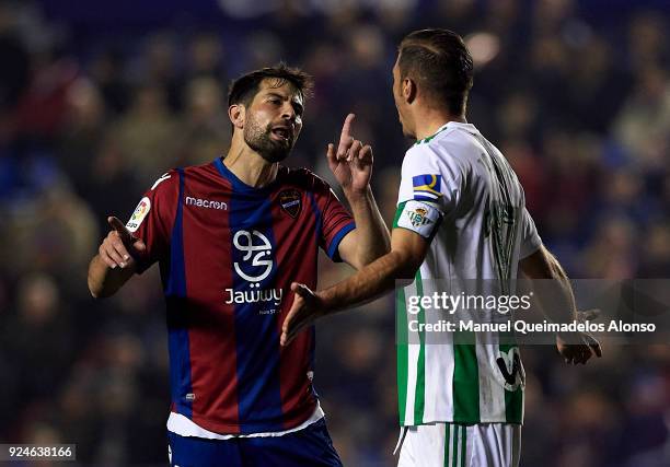 Coke of Levante and Joaquin Sanchez of Betis argue during the La Liga match between Levante and Real Betis at Ciudad de Valencia Stadium on February...