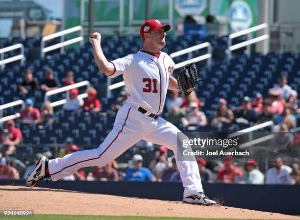 Max Scherzer of the Washington Nationals throws the ball against the Atlanta Braves during a spring training game at The Ballpark of the Palm Beaches...