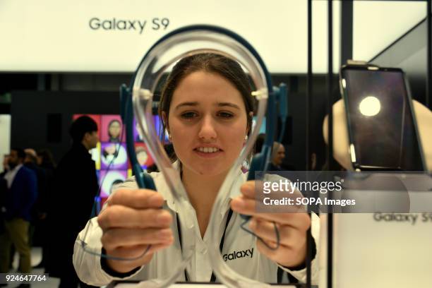 Lady seen preparing a Samsung headphone for visitors to try out. The Mobile World Congress 2018 is being hosted in Barcelona from 26 February to 1st...