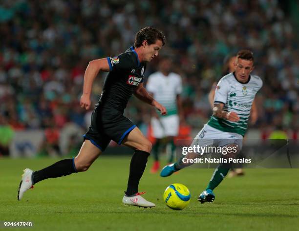 Carlos Fierro of Cruz Azul and Brian Lozano of Santos fight for the ball during the 9th round match between Santos Laguna and Cruz Azul as part of...