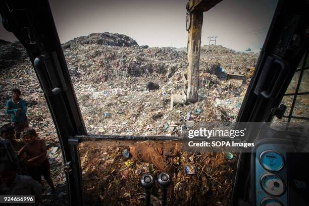 General view the slums and garbage disposal sites in the outskirts of New Delhi. Over 25 million people live in Delhi, India. What is particularly...