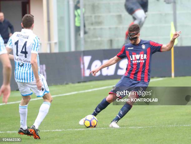 Crotone's Italian defender Mario Sampirisi with a protection mask kicks the ball during the Italian Serie A football match FC Crotone vs SPAL on...