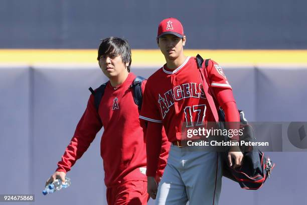 Shohei Ohtani of the Los Angeles Angels arrives to the spring training game against the San Diego Padres with his translator Ippei Mizuhara at Peoria...