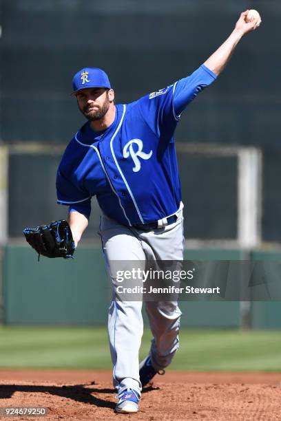 Brian Flynn of the Kansas City Royals throws a warm up pitch prior to the first inning of the spring training game against the San Francisco Giants...