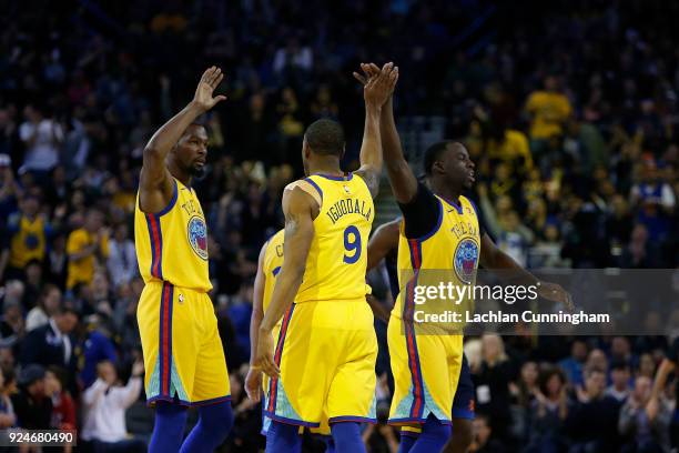 Kevin Durant, Draymond Green and Andre Iguodala of the Golden State Warriors celebrate during the game against the Oklahoma City Thunder at ORACLE...