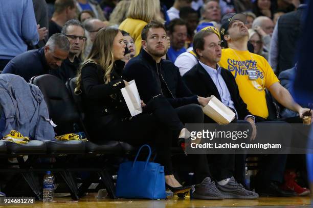 Former Golden State Warriors player David Lee and his fiancée Caroline Wozniacki watch the game between the Oklahoma City Thunder and the Golden...