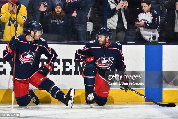 Boone Jenner and Taylor Chorney of the Columbus Blue Jackets talk during pregame warmups prior to a game against the Washington Capitals on February...