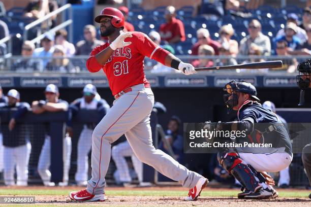 Chris Carter of the Los Angeles Angels hits a double against the San Diego Padres during the second inning of the spring training game at Peoria...