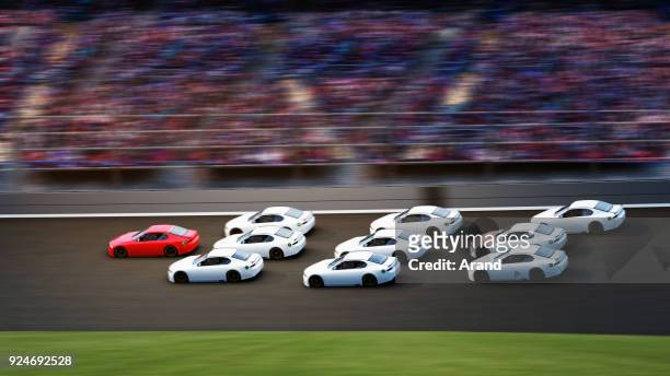 leadership concept. red car is the leader,american stock cars racing in motion on racetrack - nascar stock pictures, royalty-free photos & images