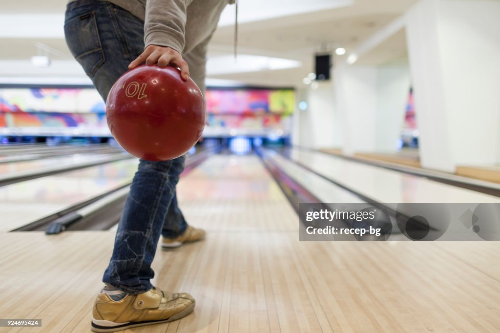 Man about to throw bowling ball