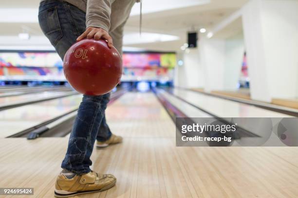 man about to throw bowling ball - bowling stock pictures, royalty-free photos & images