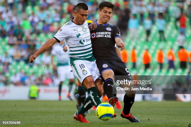 Osvaldo Martinez of Santos fights for the ball with Oscar Bernal of Santos during the 9th round match between Santos Laguna and Cruz Azul as part of...