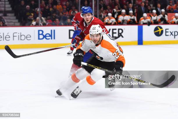 Philadelphia Flyers Defenceman Brandon Manning changes direction to go towards the puck while chased by Montreal Canadiens Right Wing Artturi...