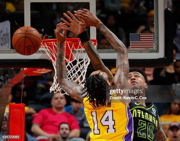 Brandon Ingram of the Los Angeles Lakers has his dunk blocked by John Collins of the Atlanta Hawks at Philips Arena on February 26, 2018 in Atlanta,...