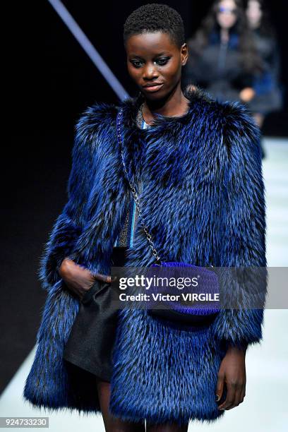 Model walks the runway at the Emporio Armani Ready to Wear Fall/Winter 2018-2019 fashion show during Milan Fashion Week Fall/Winter 2018/19 on...