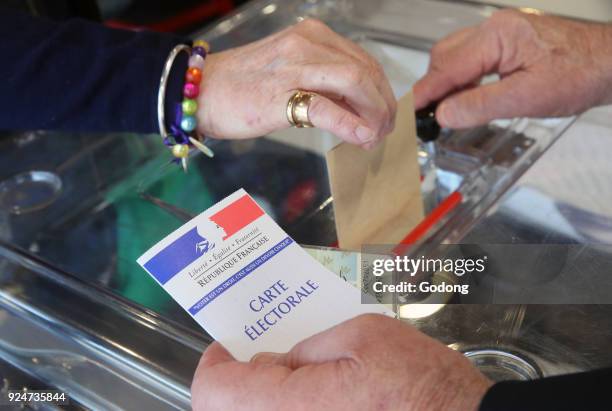 Polling Booth in France. Hand dropping ballot. France. .