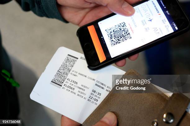 Geneva airport. E-ticket on Iphone. Switzerland.