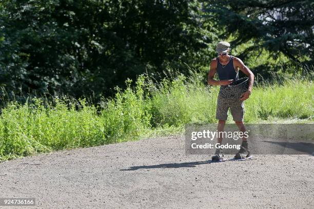 Gardner planting grass seed. France. .