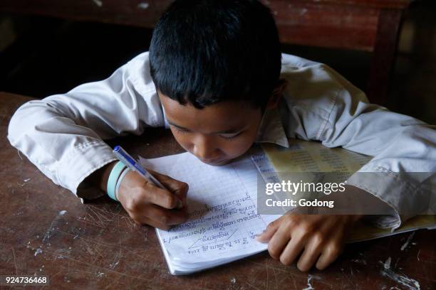 Cambodian schoolboy working. Battambang. Cambodia. .