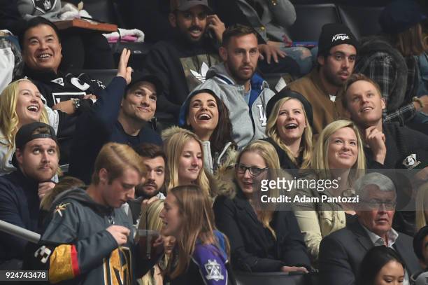 Actors Ashton Kutcher, Mila Kunis, and Elisha Cuthbert attend a game between the Vegas Golden Knights and the Los Angeles Kings at STAPLES Center on...
