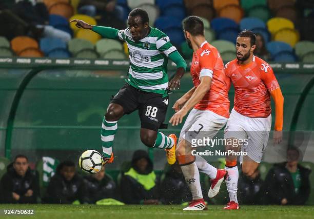 Sporting's forward Seydou Doumbia vies with Moreirense's defender Andre Micael and Moreirense's midfielder Zizo during the Portuguese League football...