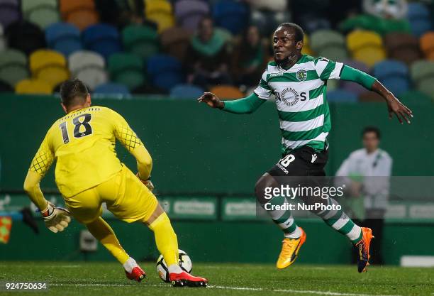 Sporting's forward Seydou Doumbia vies with Moreirense's goalkeeper Jhonatan during the Portuguese League football match between Sporting CP and...
