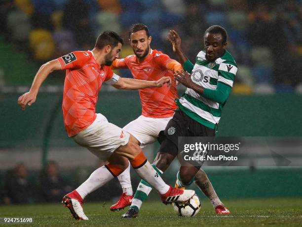 Sporting's forward Seydou Doumbia vies for the ball with Moreirense's defender Andre Micael and Moreirense's defender Mohamed Aberhoune during...