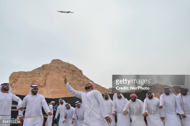 Group of local men perform the 'stick dance', a traditional fascinating UAE folk dance, at the finish line of the fifth and final stage of the 2018...