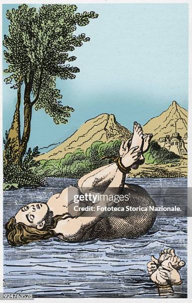 Two alleged witches subjected to the ordeal of water; women were thrown into the water with their hands and feet bound. If they drowned they would...