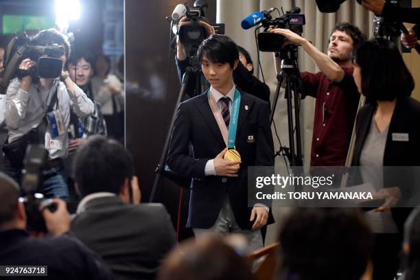 Figure skating men's single gold medallist at the Pyeongchang 2018 Winter Olympic Games Yuzuru Hanyu arrives at the Foreign Correspondents' Club for...