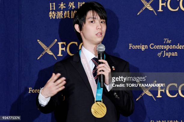 Yuzuru Hanyu, men's single figure skating gold medallist at the Pyeongchang 2018 Winter Olympic Games, speaks during a press conference at the...
