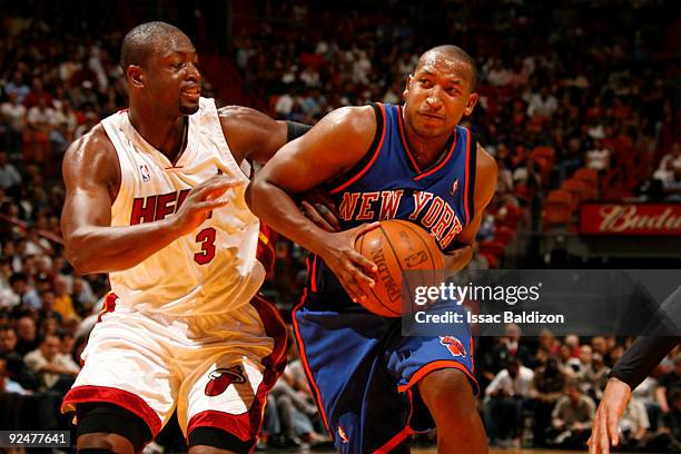 Chris Duhon of the New York Knicks drives against the Miami Heat on October 28, 2009 at American Airlines Arena in Miami, Florida. NOTE TO USER: User...
