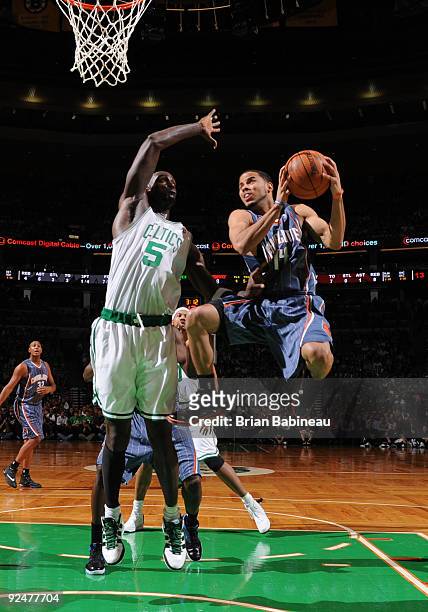 Augustin of the Charlotte Bobcats drives the lane against Kevin Garnett of the Boston Celtics on October 28, 2009 at the TD Garden in Boston,...
