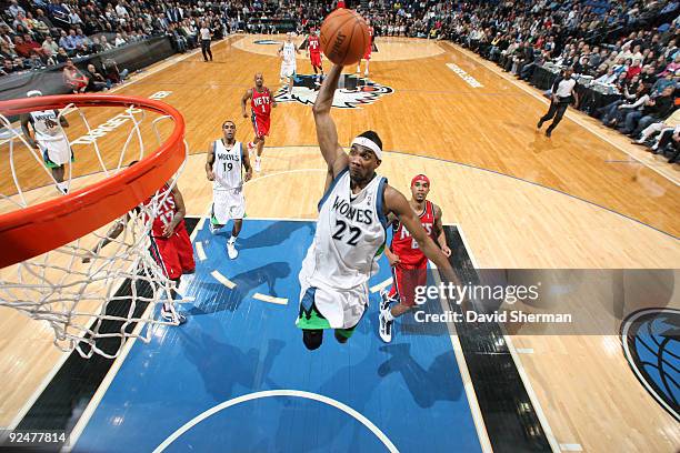 Corey Brewer of the Minnesota Timberwolves dunks against the New Jersey Nets during the season opening game on October 28, 2009 at the Target Center...