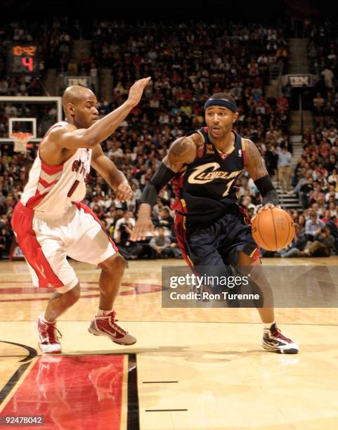 Mo Williams oft the Cleveland Cavaliers attempts to drive to the basket past defender Jarrett Jack of the Toronto Raptors during a game on October...