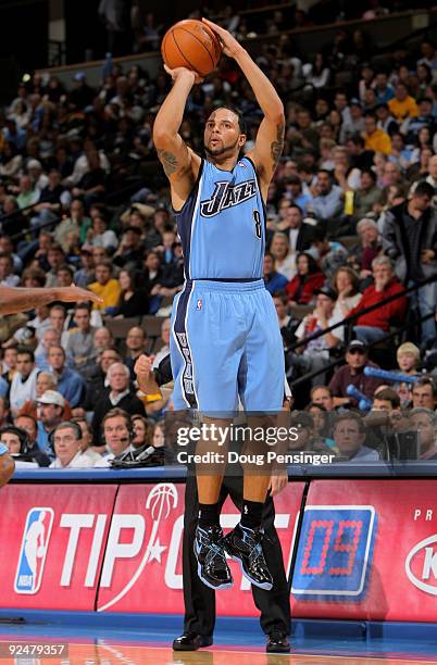 Deron Williams of the Utah Jazz takes a shot as he had a team high 28 points against the Denver Nuggets during NBA action at Pepsi Center on October...