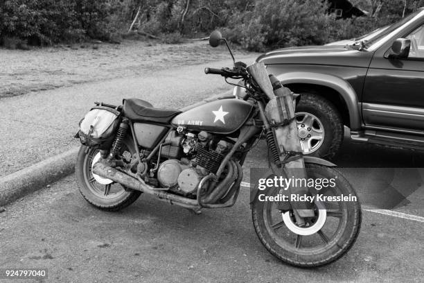 motorcycle with holstered rifle - yamaha corporation fotografías e imágenes de stock