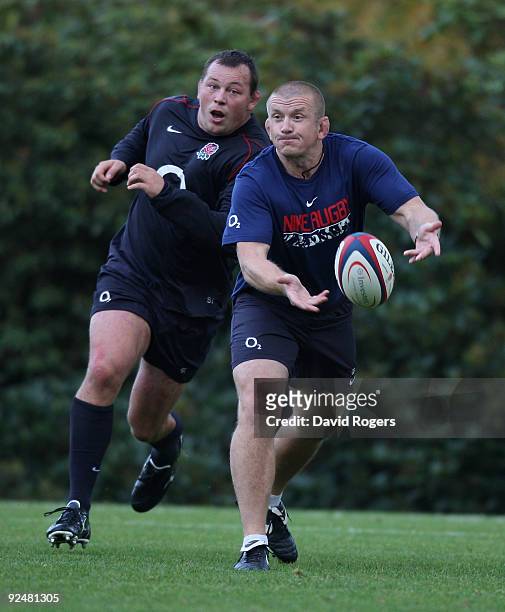 Graham Rowntree, the England scrum coach passes the ball during the England training session held at Pennyhill Park on October 28, 2009 in Bagshot,...