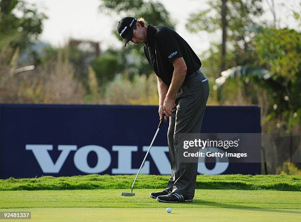 Retief Goosen of South Africa putts on the 4th green during Day One of the Group Stage of the Volvo World Match Play Championship at Finca Cortesin...